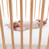 baby sleeping in crib wearing Kyte  
