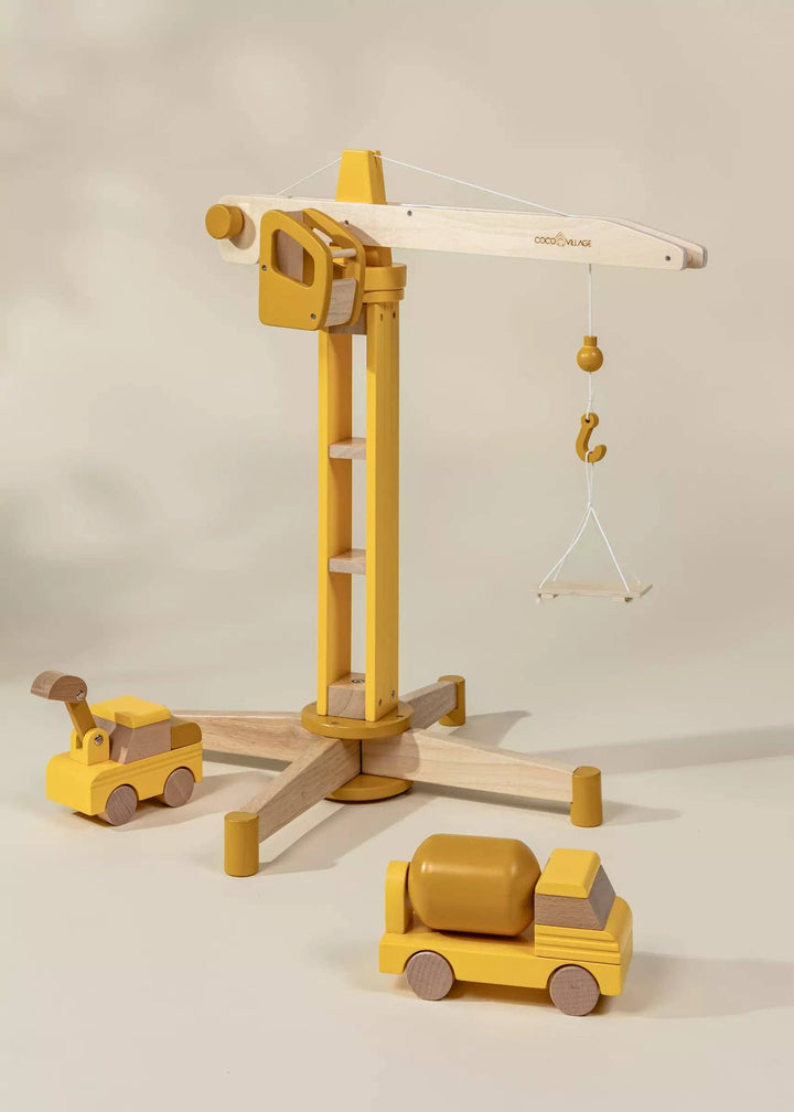 Lift, lower, and build with the Coco Village Oversized Wooden Construction Crane, a beautifully designed large wooden toy for young engineers.