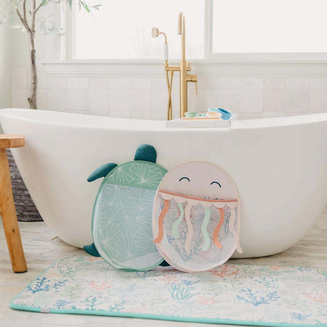 Copper Pearl bath toy organizer near bathtub, stylish mesh caddy for organizing baby bath toys