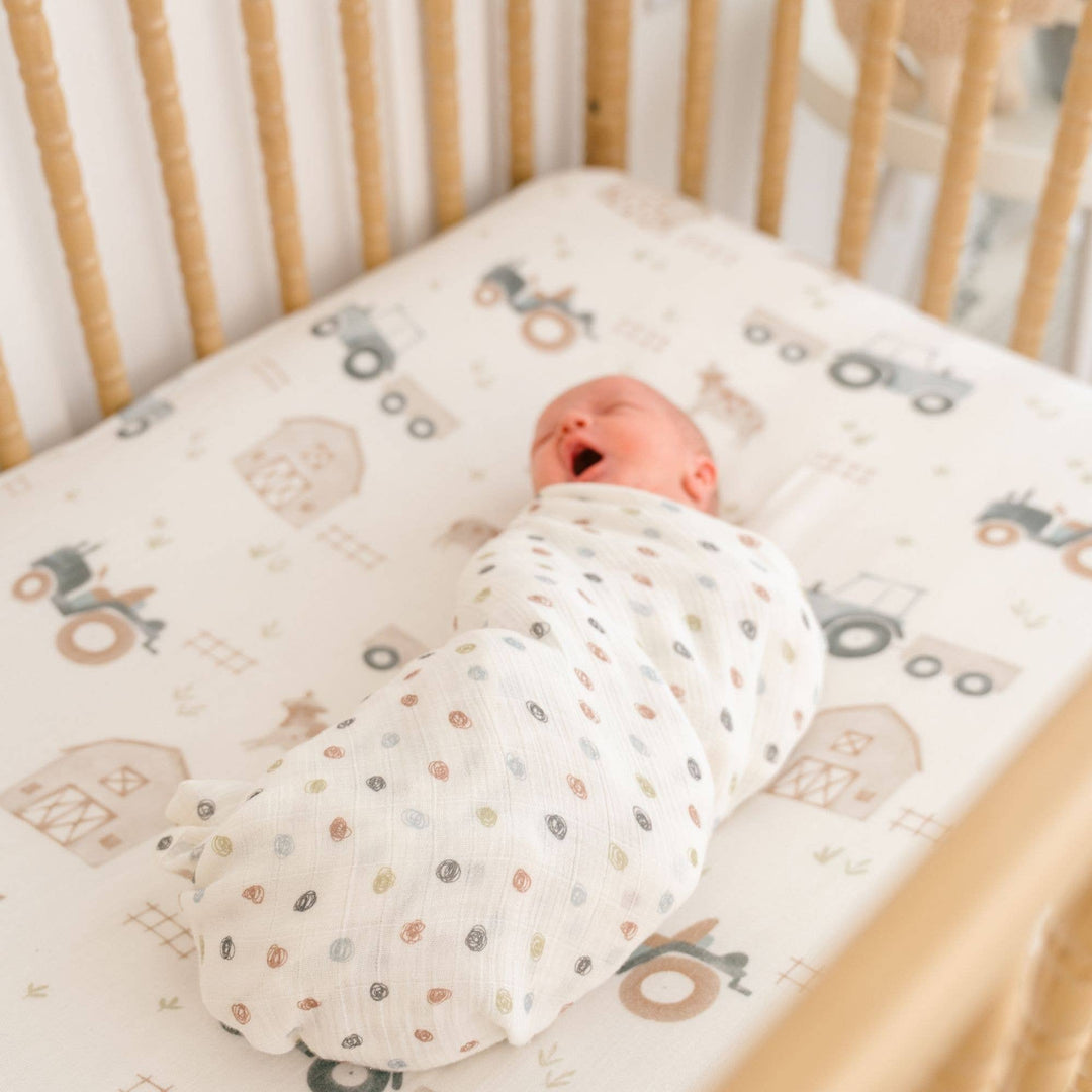 newborn in crane baby organic cotton swaddle set 