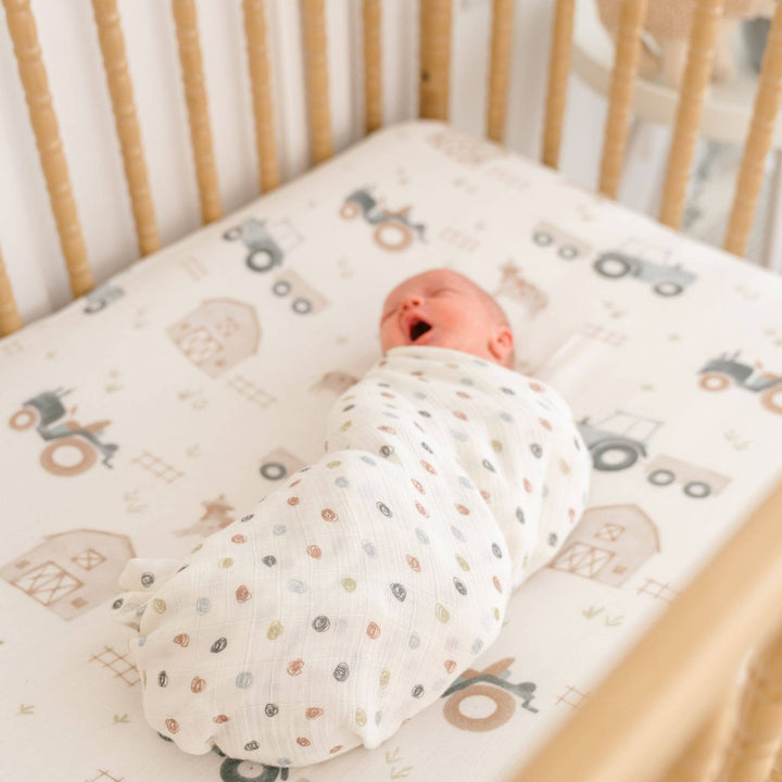 newborn in crane baby organic cotton swaddle set 