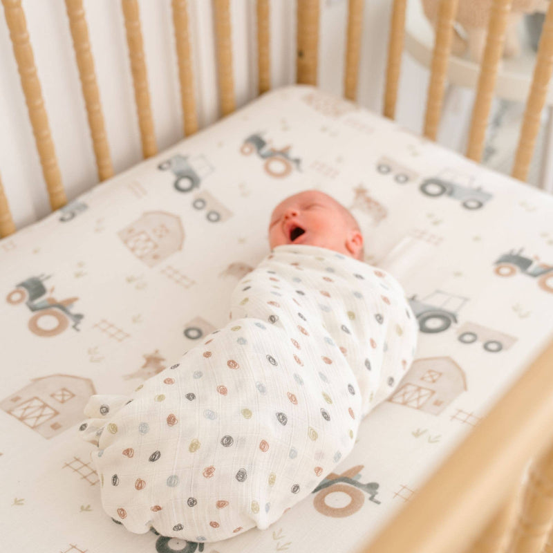 newborn in crane baby organic cotton swaddle set 