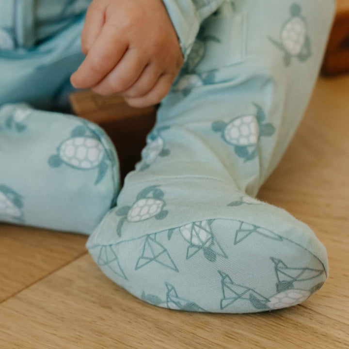 Detail of Copper Pearl Wade footed pajama showing fabric and fit, cozy baby sleepwear for naps and bedtime