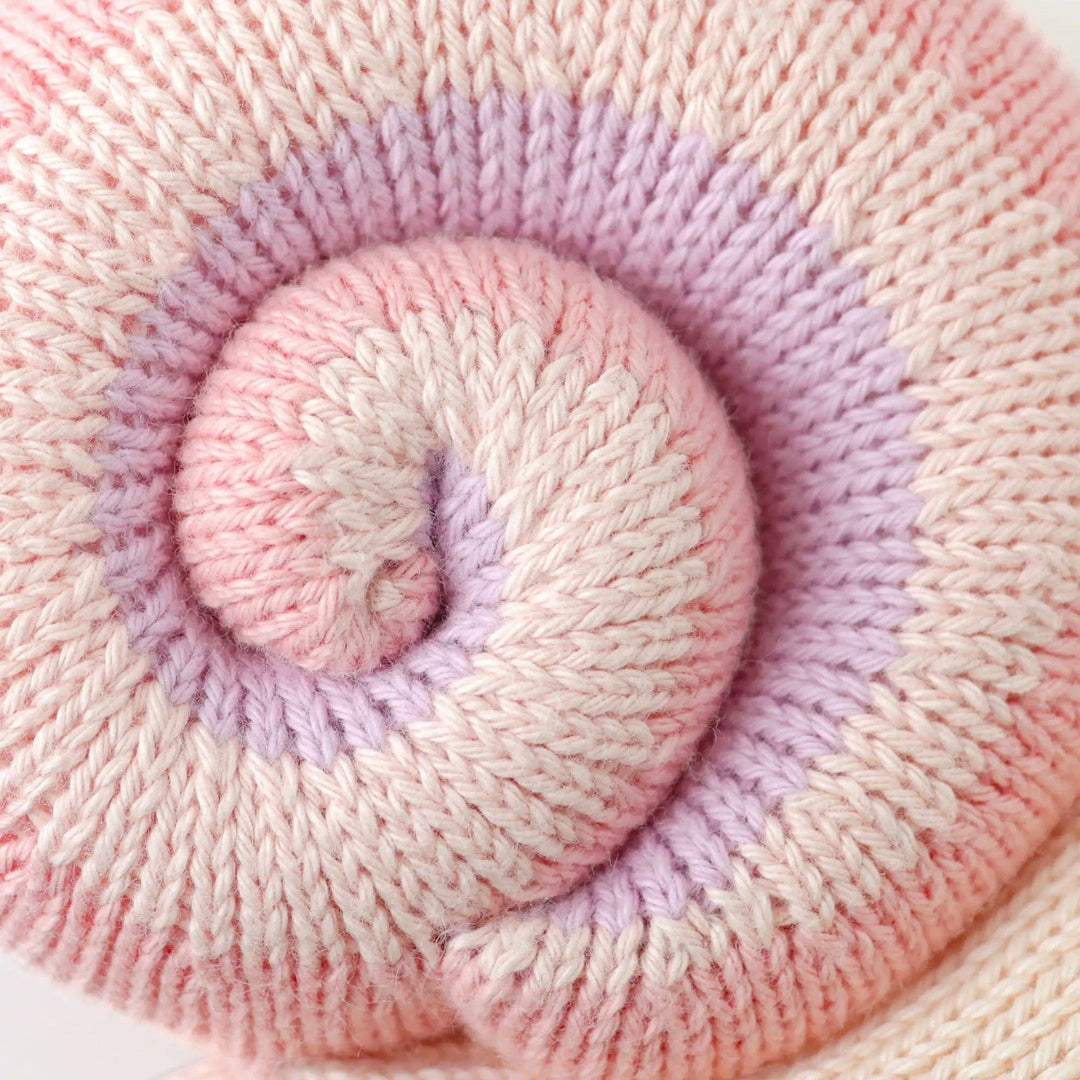 Baby Snail Peony by Cuddle + Kind — soft pink hand-knit collectible snail stuffed animal toy