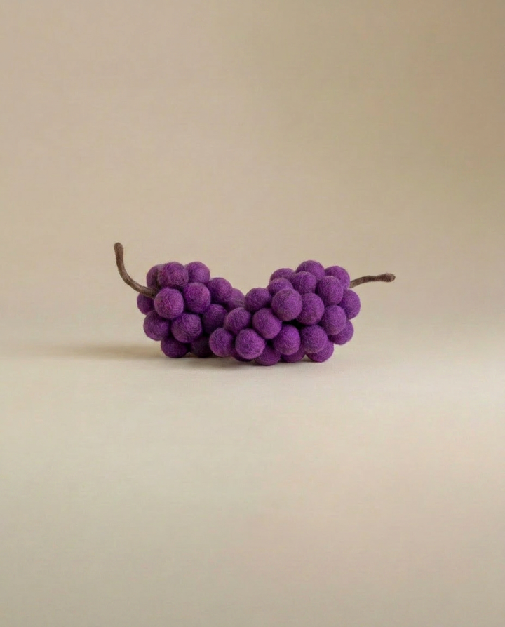 Close-up detail of Kaddu's Felt Grapes cluster showing handcrafted texture