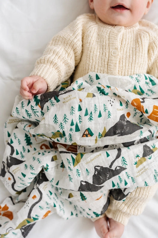 Clementine Kids National Parks Mini Pattern Swaddle styled as lightweight muslin cotton fabric.