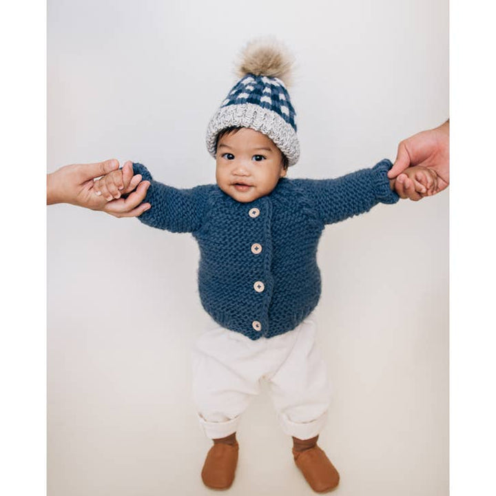 Baby learning to walk in Huggalugs Slate blue cardigan and beanie, hand knit toddler sweater set