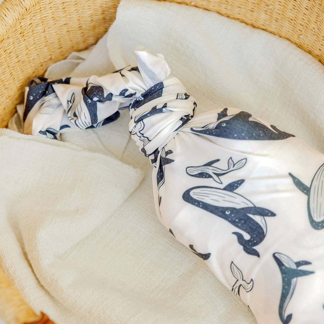 Copper Pearl Cove 46x46 muslin-style knit swaddle blanket in soft gender-neutral tones