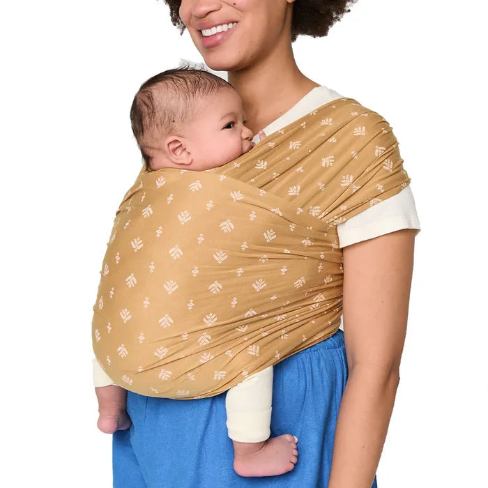 Camel tones bring warmth to the Ergobaby Aura Baby Wrap, a stylish and supportive baby wrap carrier.