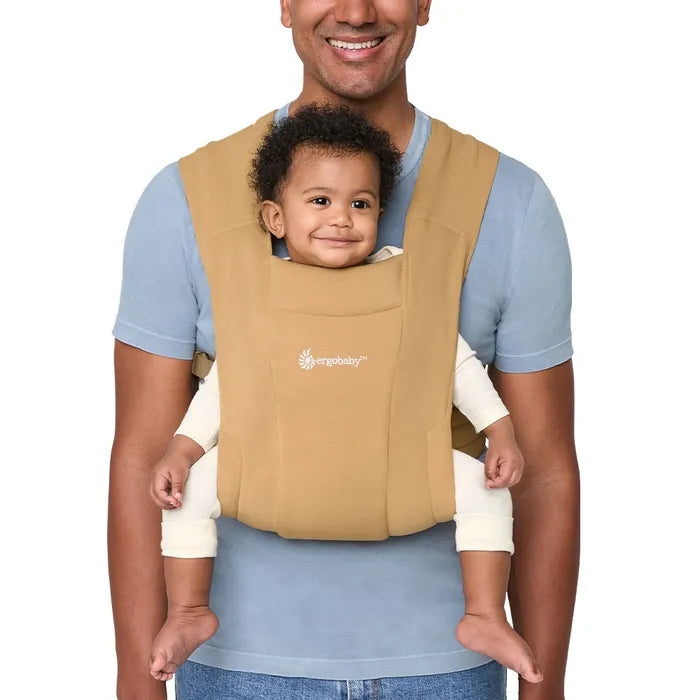 Camel tones add warmth to the Ergobaby Embrace Newborn Carrier, a front baby carrier for stylish comfort.