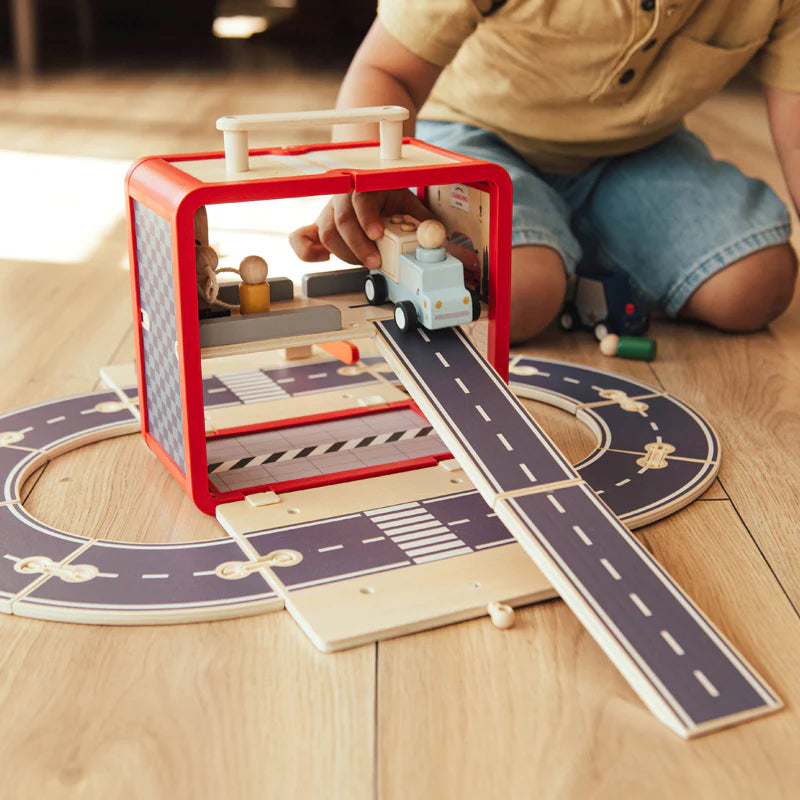 Take with Me Garage open and fully set up with ramp extended and vehicles on track