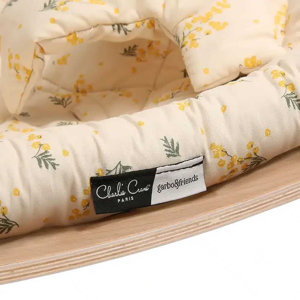 Minimalist craftsmanship defines the camel Charlie Crane Levo Beech Wood Rocker, a sophisticated baby rocker choice