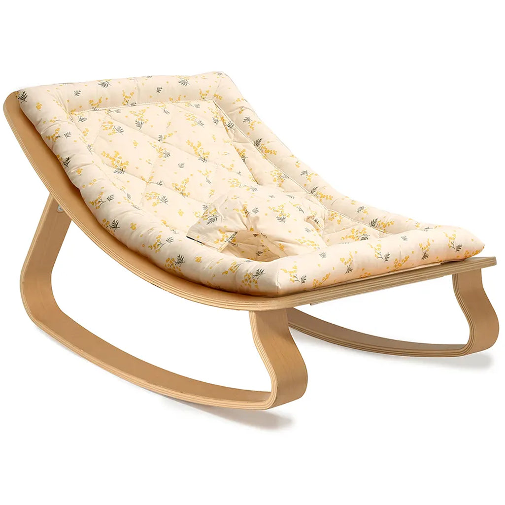 Minimal nursery styling featuring Charlie Crane Levo Rocker Beech Wood in organic milk, a sustainable baby bouncer option
