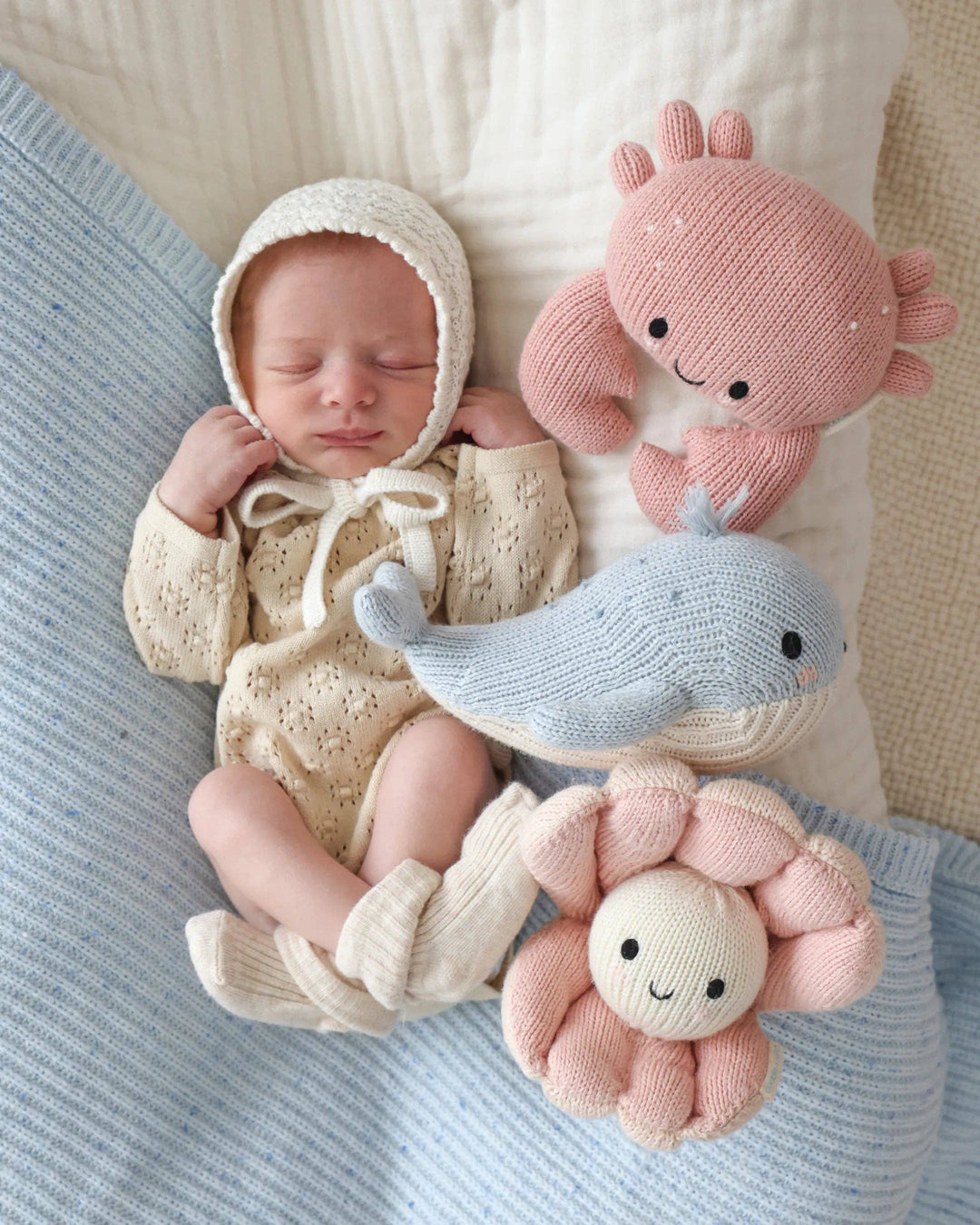 Cuddle + Kind Baby Crab in Blush handmade fair trade crab stuffed animal for newborns