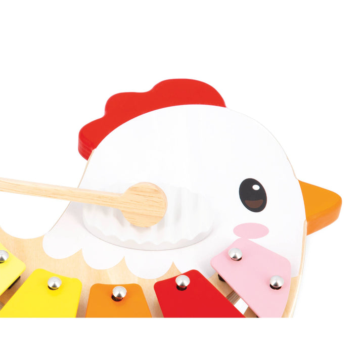 Baby playing Janod Farm Chicken Xylophone wooden musical instrument
