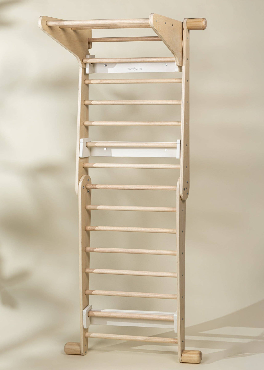 Encourage self-led play with the Coco Village Montessori 2-in-1 Triangle & Wall Climber in Natural wood, a versatile baby toys essential.