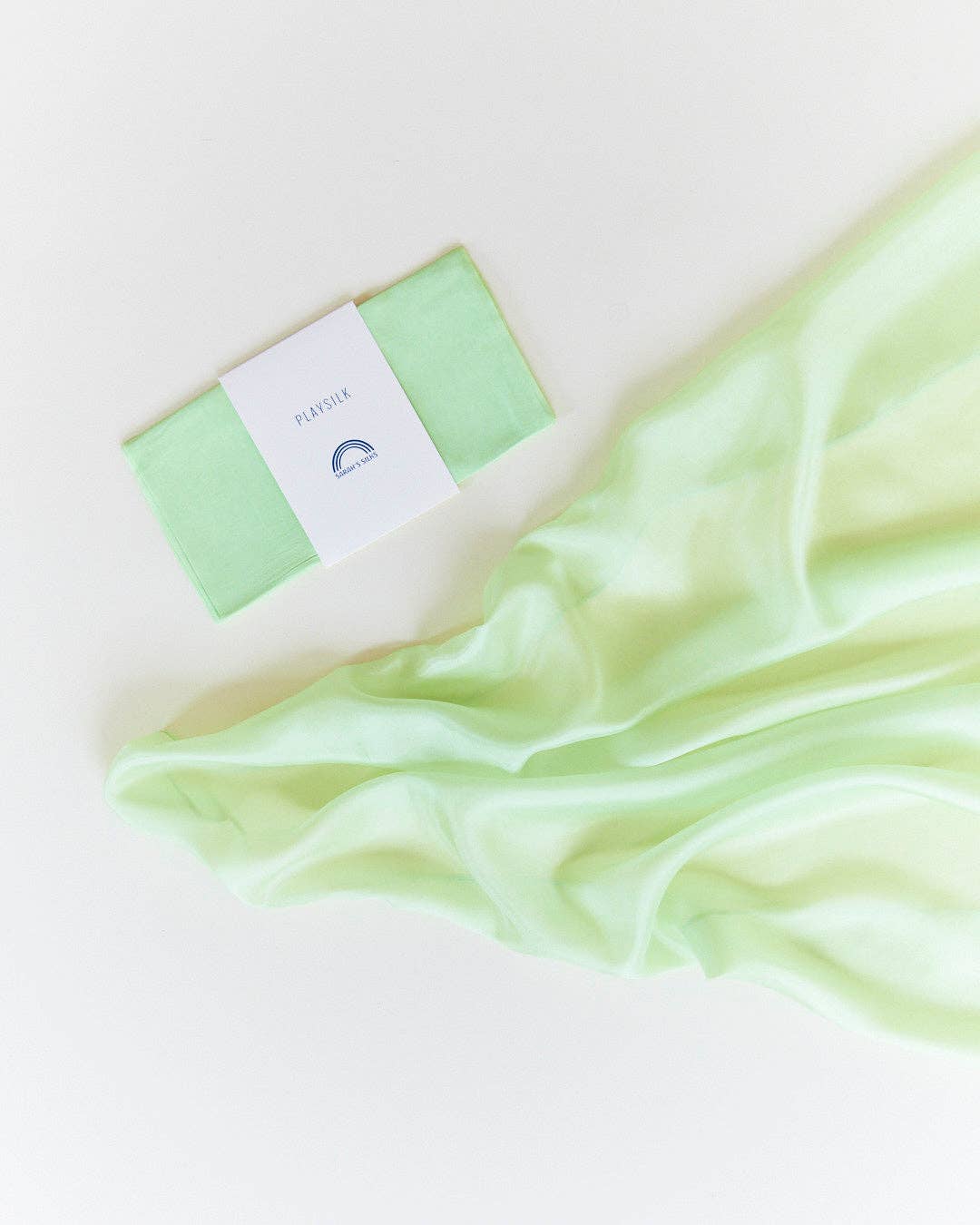 Mint green silk scarf flat lay, Sarah's Silks Solid Color Playsilks, a top pick for pretend play