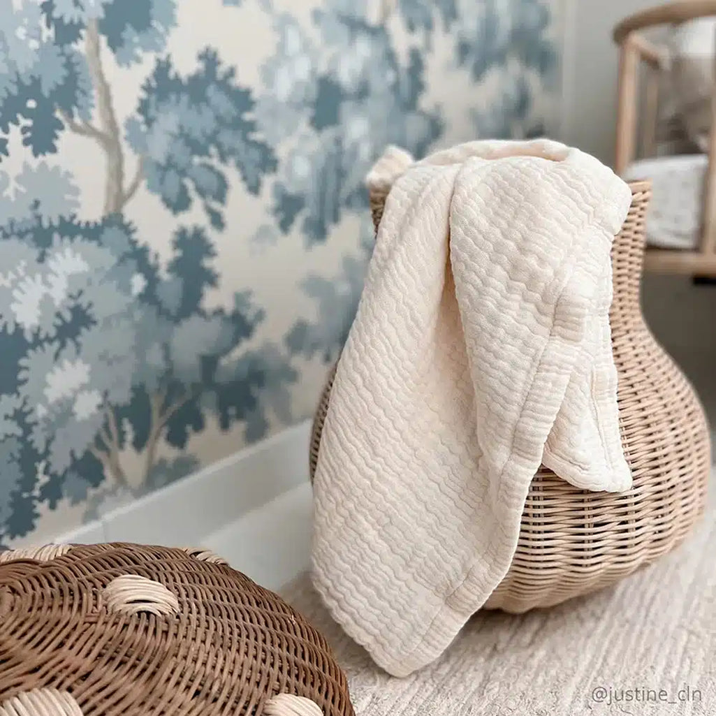 Laid flat view of the Charlie Crane Doli Milk Blanket in milk showing a soft texture ideal for everyday infant comfort