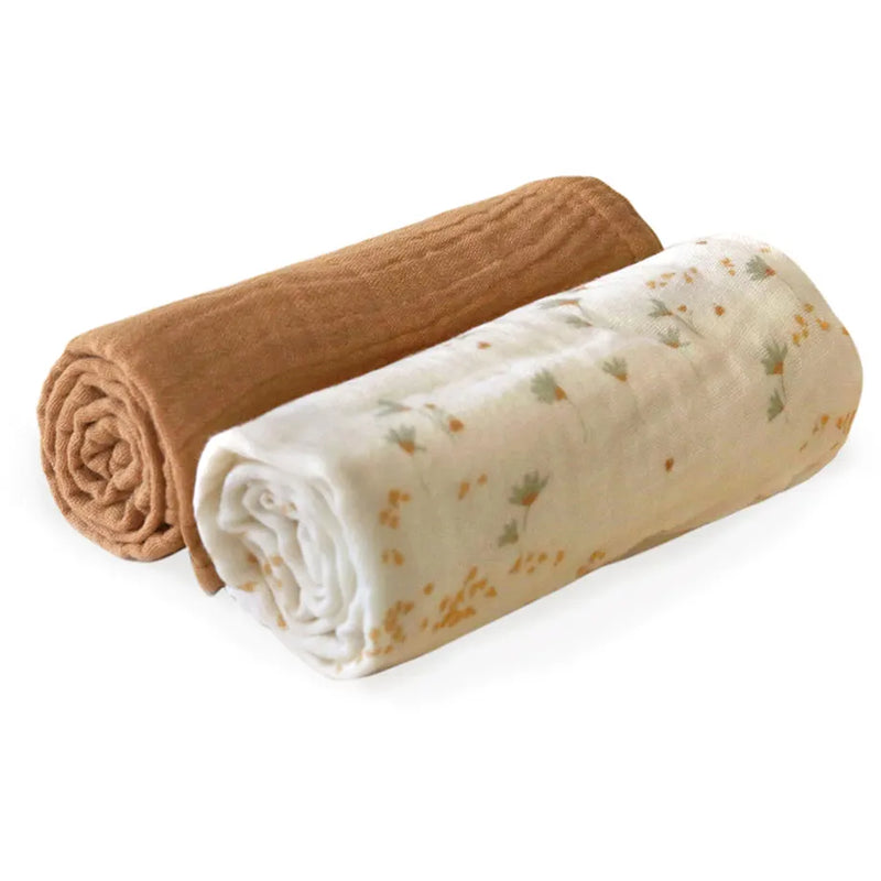 Close up fabric detail highlights the Charlie Crane DOLI Swaddle Set in milk camel and lichen featuring a refined knit texture