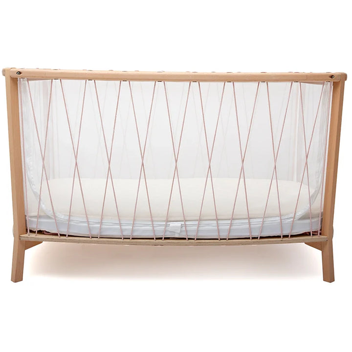 Classic wooden finish highlights the KIMI Evolving Bed by Charlie Crane in desert as a crib daybed for newborns