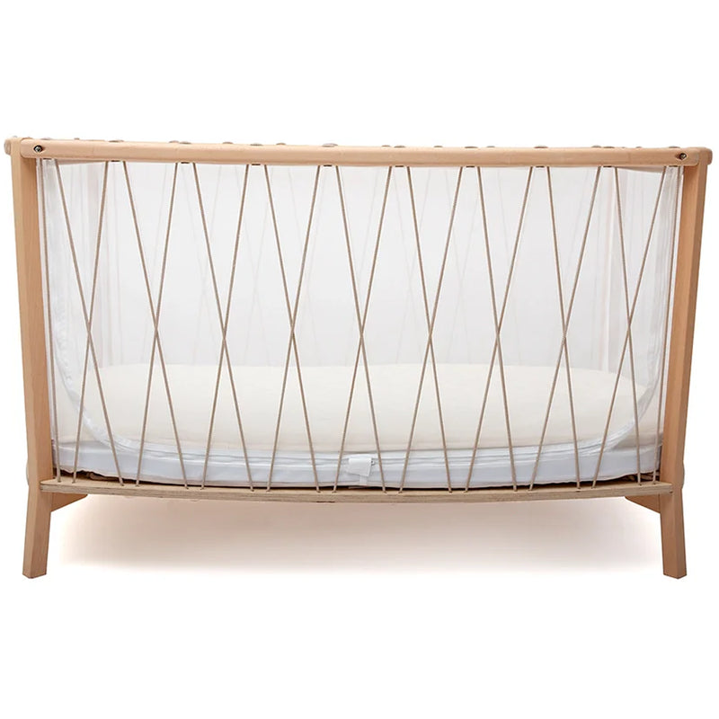Modern minimal nursery features the Baby KIMI Evolving Bed by Charlie Crane in desert crafted for toddler bed use
