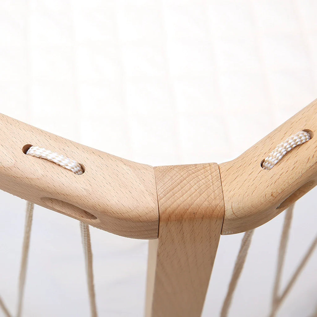 Hazelnut nursery vignette shows the Baby KIMI Evolving Bed by Charlie Crane with a safe coconut fiber mattress