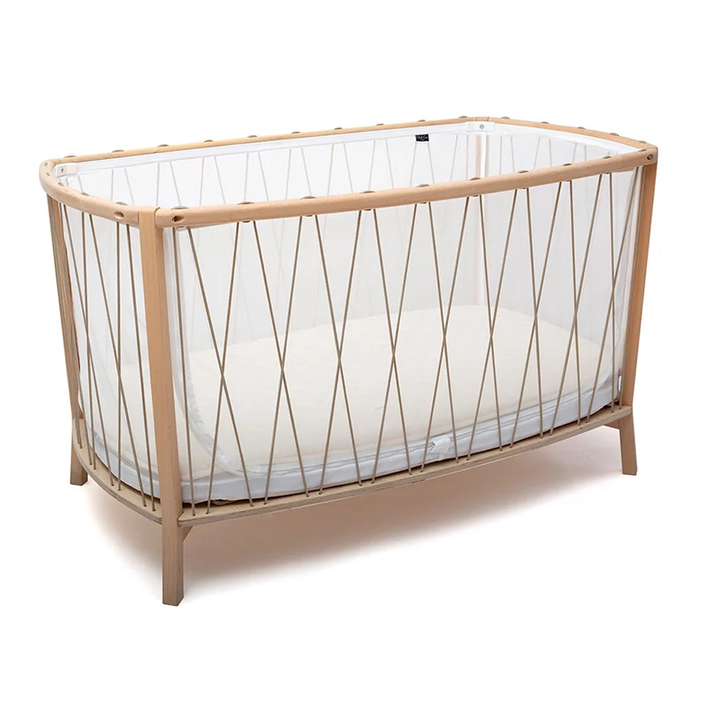 Bois de rose nursery display shows the Charlie Crane KIMI Baby Bed Evolving as a sophisticated crib daybed