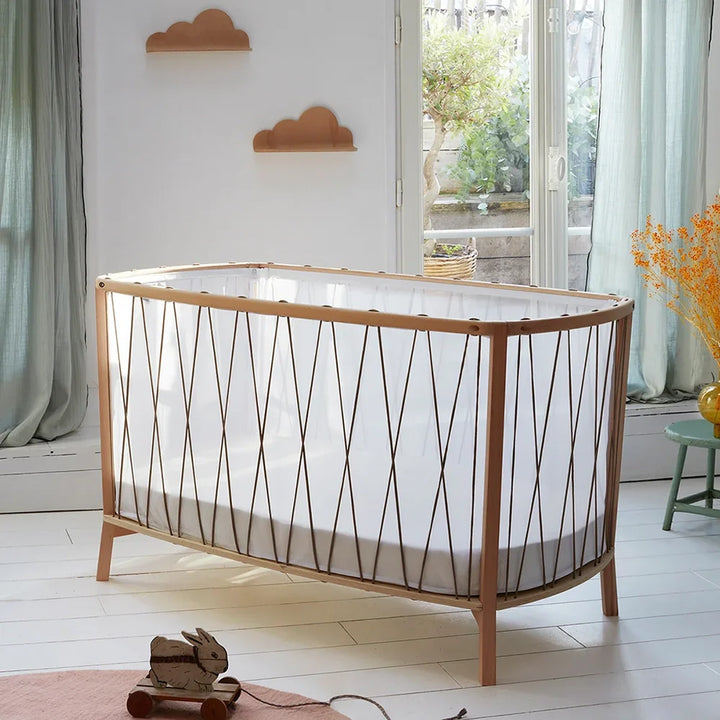 Desert nursery scene features the Baby KIMI Evolving Bed Charlie Crane with European beech and safe design