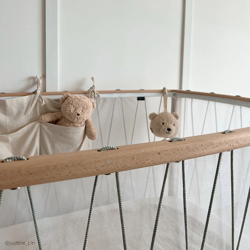 Hazelnut interior view highlights the Charlie Crane KIMI Evolving Baby Bed as a toddler bed with natural wood finish
