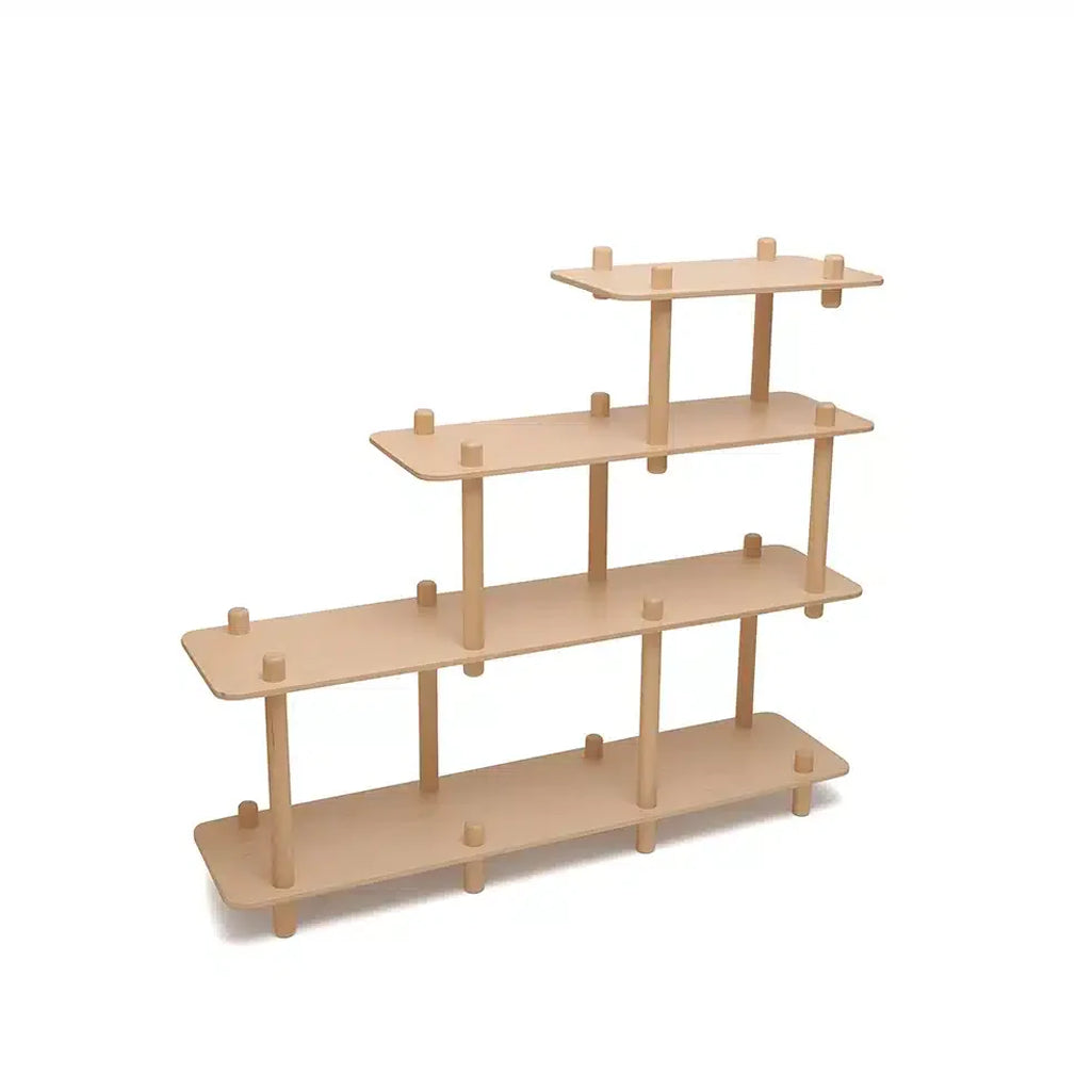 Angled nursery styling shows the Charlie Crane FILO Bookshelf in natural with a midcentury modern look for curated spaces