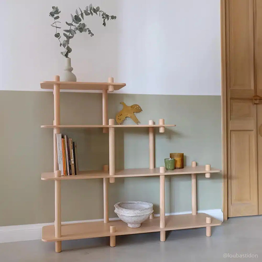 Minimal room setup features the Charlie Crane FILO Bookshelf in natural with a sophisticated nursery appeal