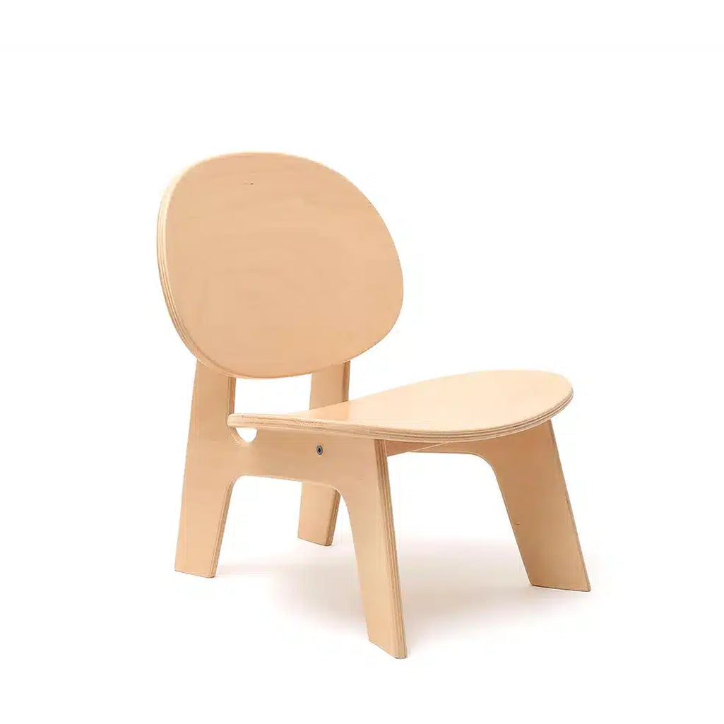 Angled nursery view shows the Charlie Crane HIBO Chair in natural with a midcentury modern design