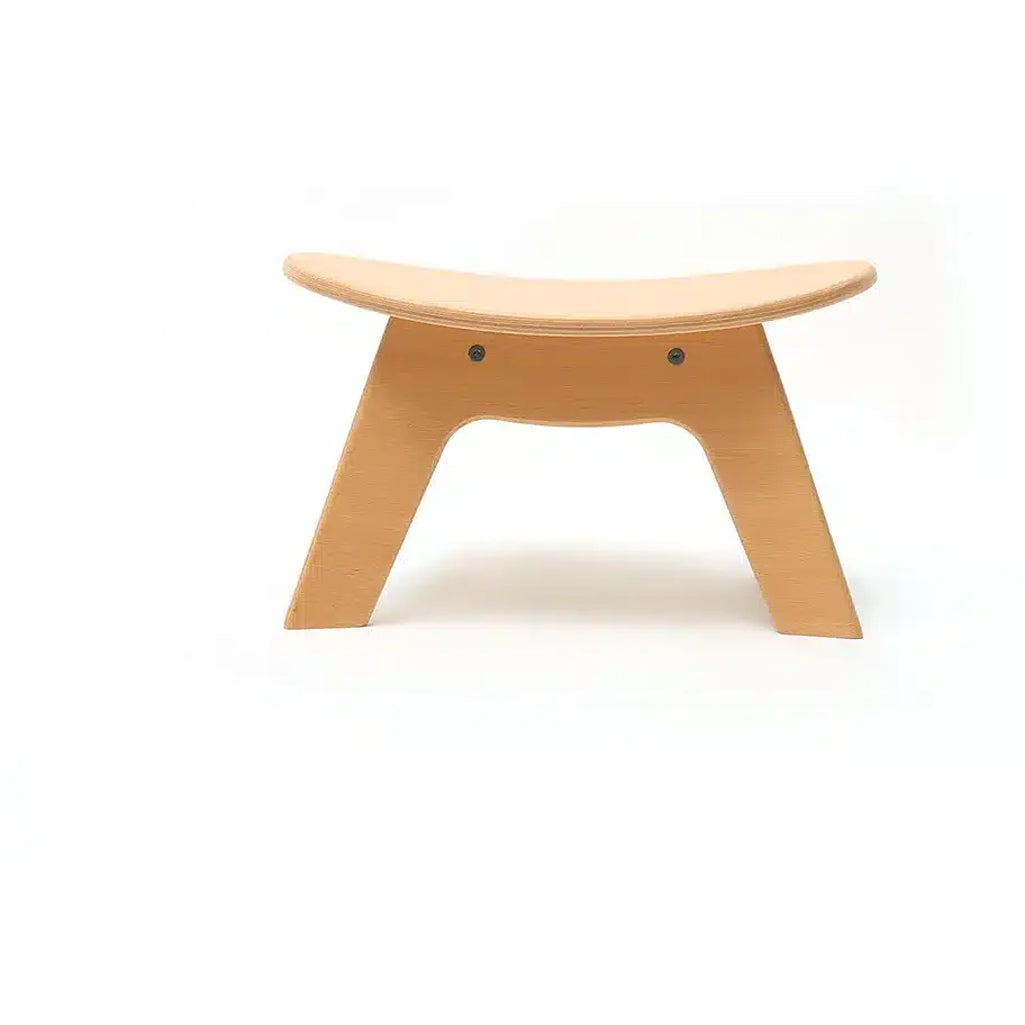 Soft textured seating presents the Charlie Crane Wooden HIBO Stool in natural with a minimalist finish
