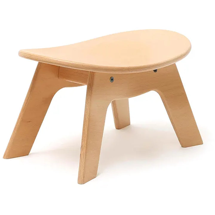 Angled nursery view shows the Charlie Crane HIBO Stool in natural with a midcentury modern design
