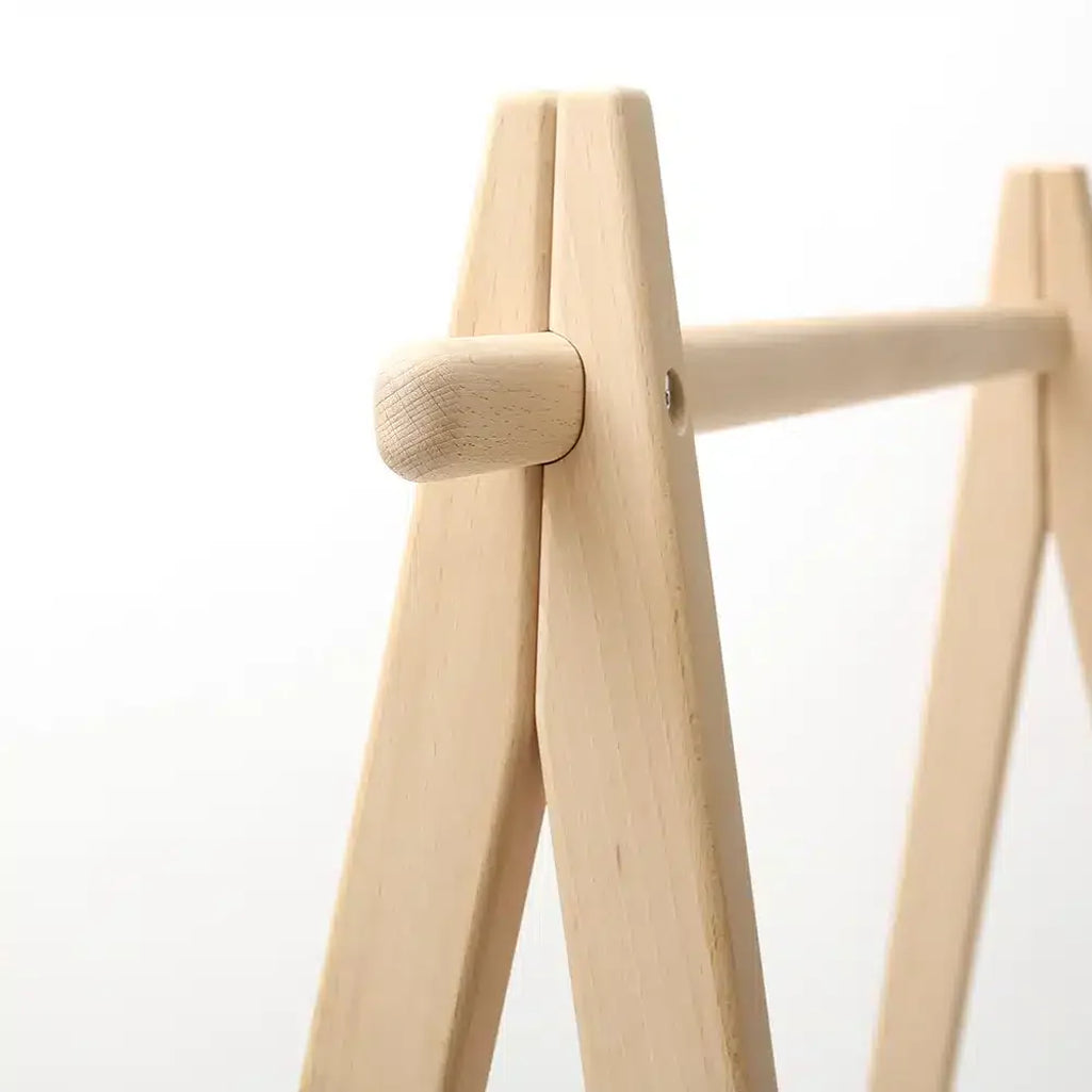 Side angle detail shows the Charlie Crane HOMI Rack in natural inspired by classic French design