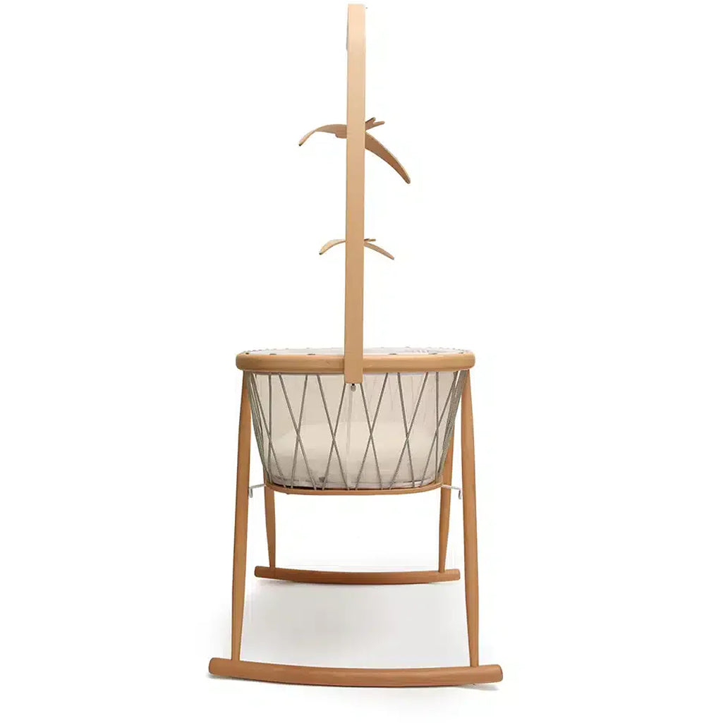 Cozy corner styling displays the Charlie Crane KANO Bed Arrow in natural designed as an infant safe bed