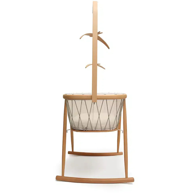 Cozy corner styling displays the Charlie Crane KANO Bed Arrow in natural designed as an infant safe bed