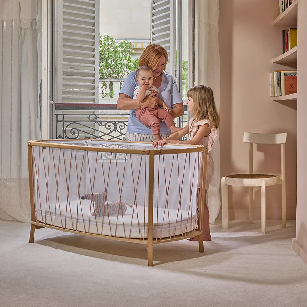 Soft light framing highlights the KIMI Baby Bed Evolving by Charlie Crane in desert as a junior bed option