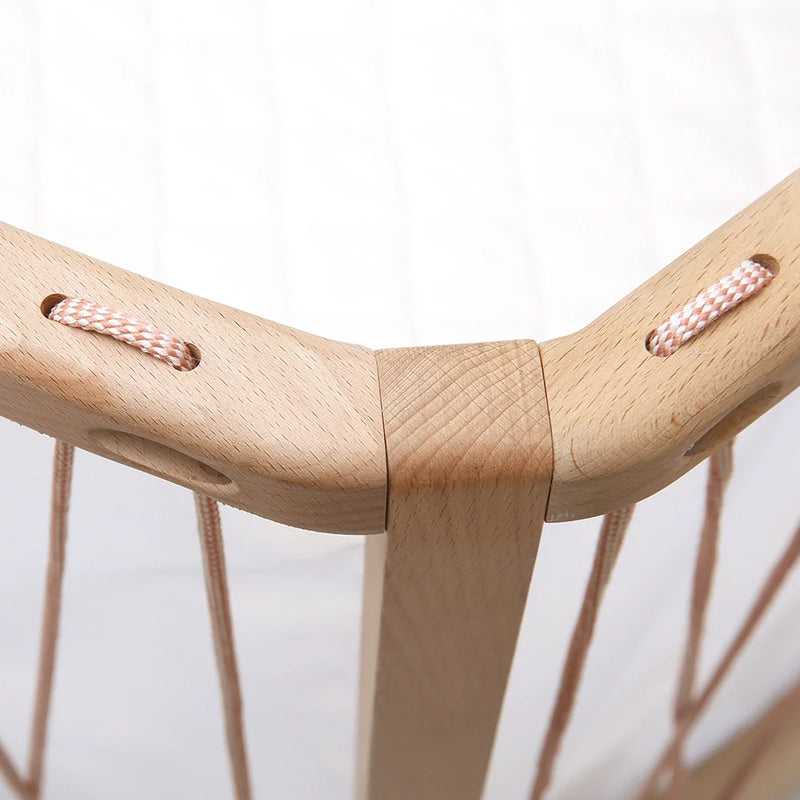 Classic wooden finish shows the Charlie Crane KIMI Baby Bed Evolving in desert with a sophisticated nursery accent