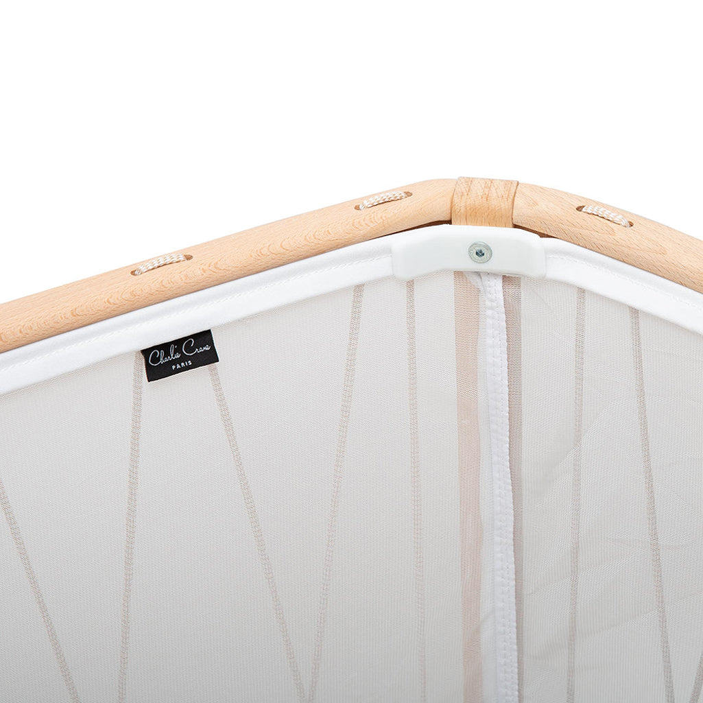 Cozy corner styling displays the KIMI Evolving Bed by Charlie Crane in bois de rose designed as a baby safe daybed crib