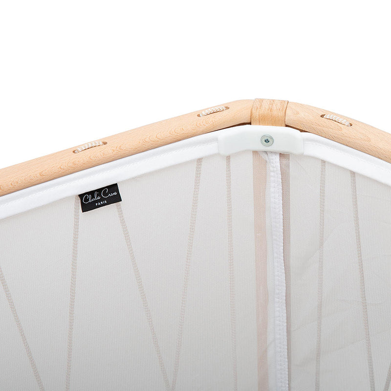 Cozy corner styling displays the KIMI Evolving Bed by Charlie Crane in bois de rose designed as a baby safe daybed crib