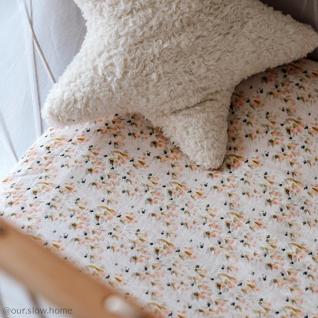 Pearl blossom baby room features the KIMI Baby Evolving Bed Charlie Crane with soft crib sheet and safe design