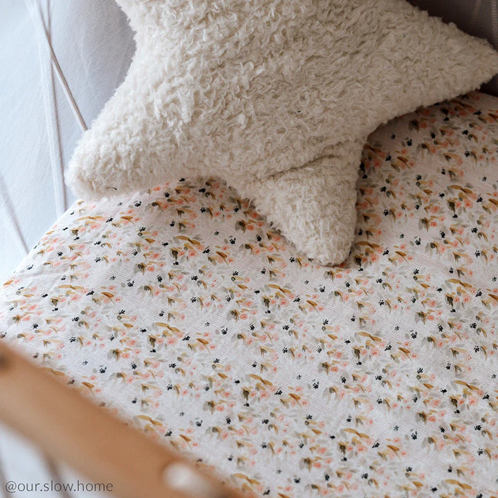 Pearl blossom baby room features the KIMI Baby Evolving Bed Charlie Crane with soft crib sheet and safe design