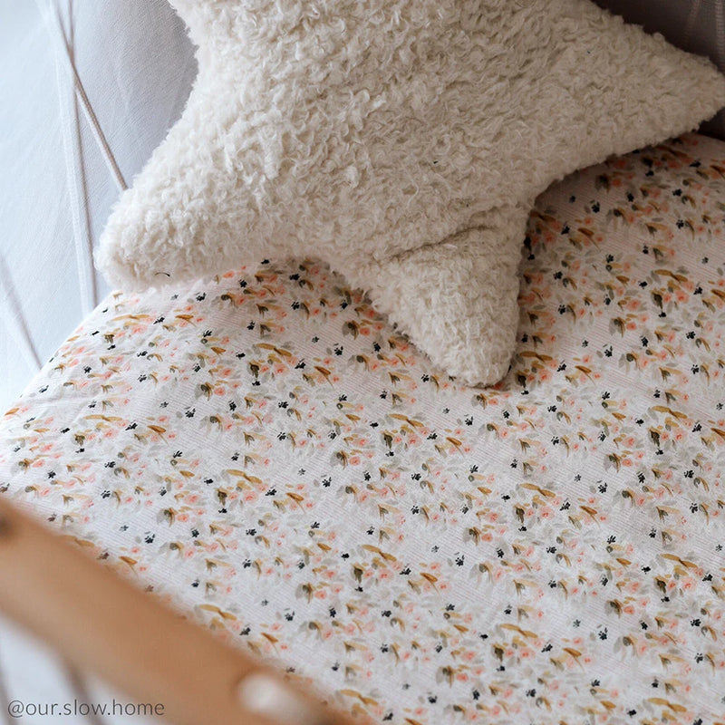 Pearl blossom baby room features the KIMI Baby Evolving Bed Charlie Crane with soft crib sheet and safe design
