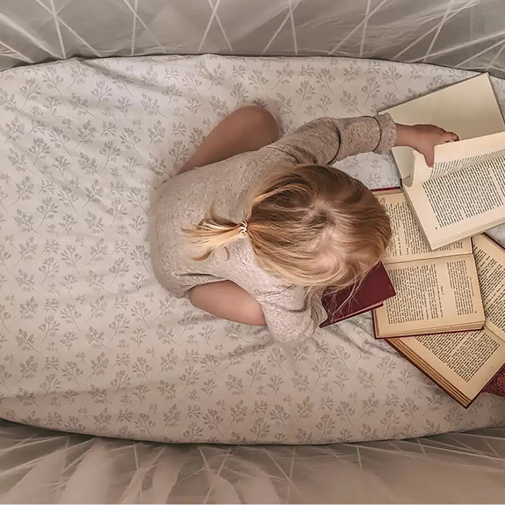 Elisabeth nursery setup shows the Charlie Crane KIMI Evolving Baby Bed with organic fitted sheet for infant comfort