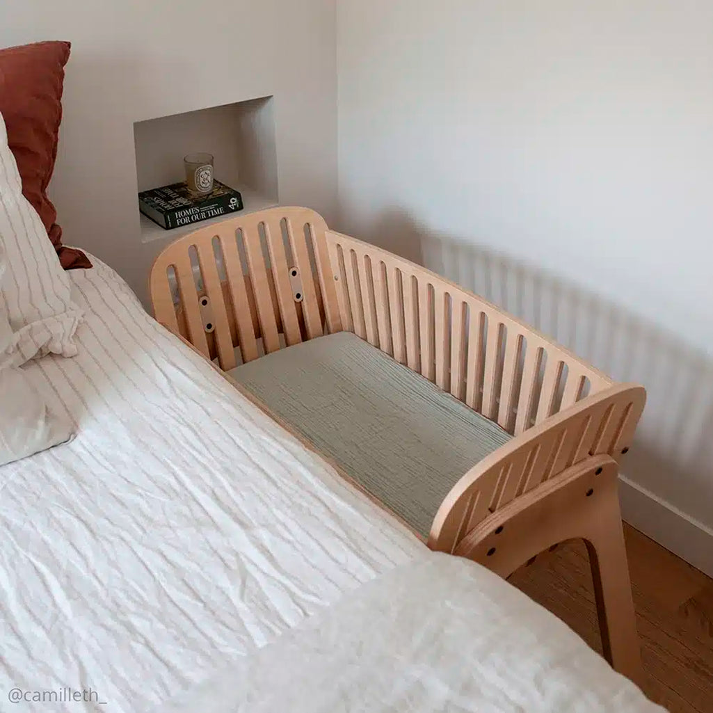 Cozy baby setup shows the KIMI Cord Charlie Crane in natural for co sleep with baby safely