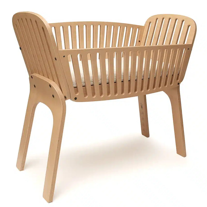 Versatile room layout presents the KIMI Cord by Charlie Crane in natural as a bassinet option