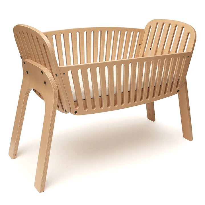 Bright newborn space includes the Charlie Crane Cord KIMI natural build that is newborn safe