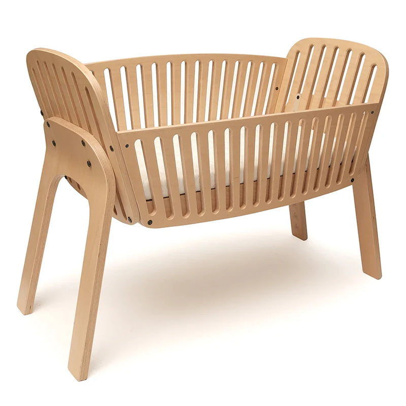 Bright newborn space includes the Charlie Crane Cord KIMI natural build that is newborn safe