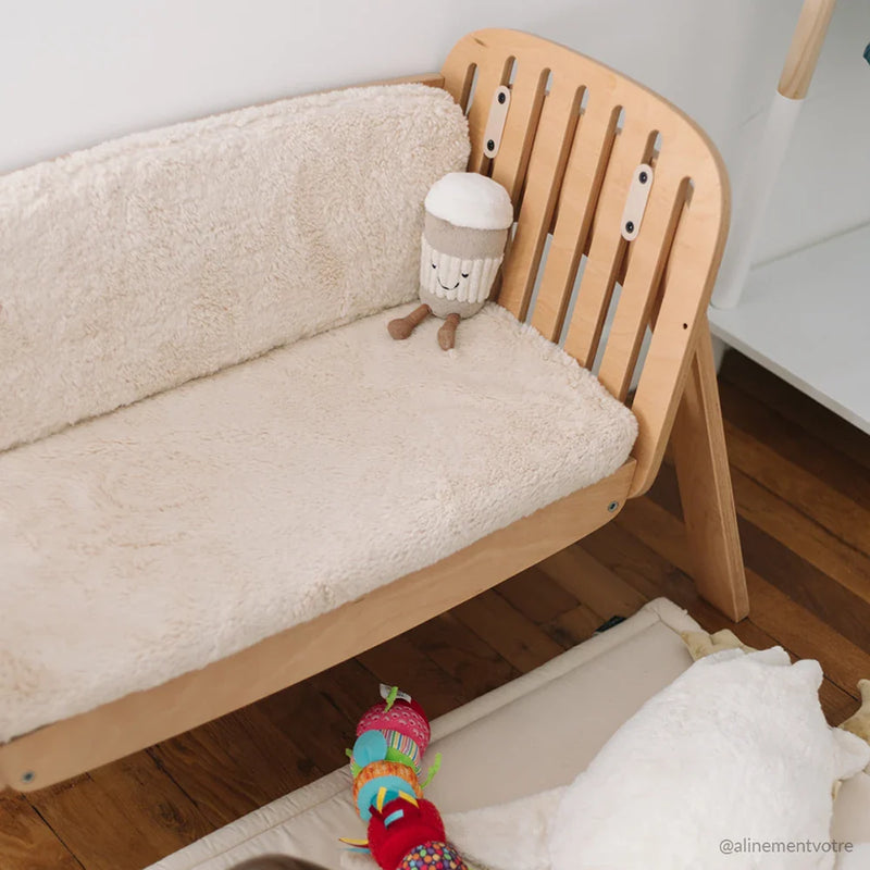 kodo charlie crane cushion showing how co sleeping crib can become a bench 